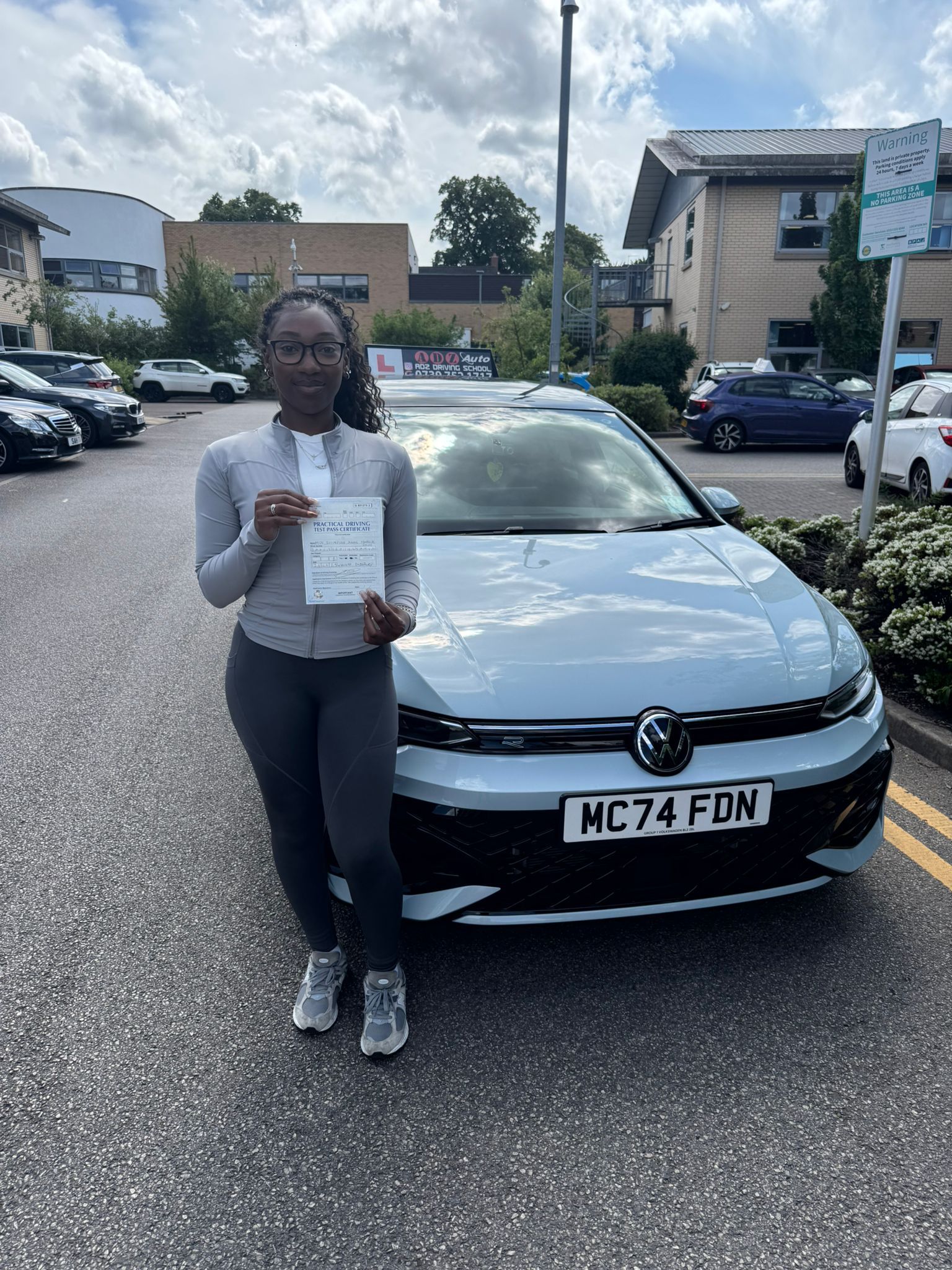 Happy student in car
